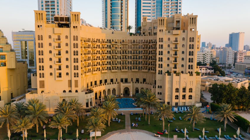A stunning view of a residential building in Ajman, showcasing the city’s thriving real estate market and architectural charm, reflecting compliance with UAE Ajman real estate laws.