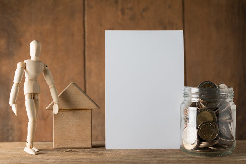 a jar with money, a wooden home, and a wooden statue represent the home improvements increases the value of property